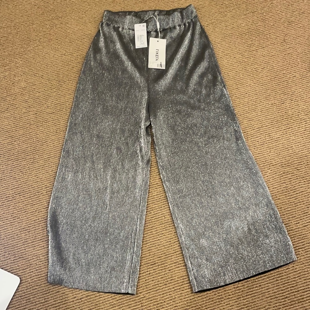 Likely wide legged cropped pants